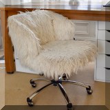 F42. Pottery Barn rolling desk chair with faux fur upholstery.  